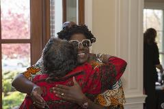 Two black women hugging