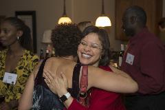 Two black women hugging