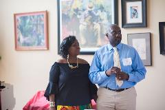 A woman and man standing in front of photos