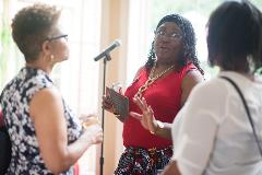 Three women having a conversation