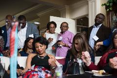 A group of people praying at an event