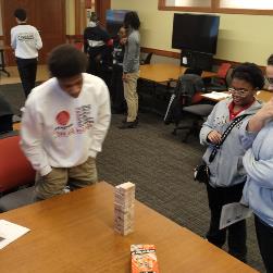 Image of Students strategizing using Jenga