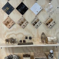 wood laser cut artifacts on display at the makerspace